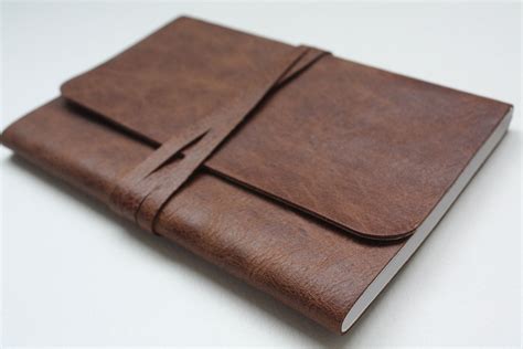 gray notebook with brown leather flap|Kitabby .